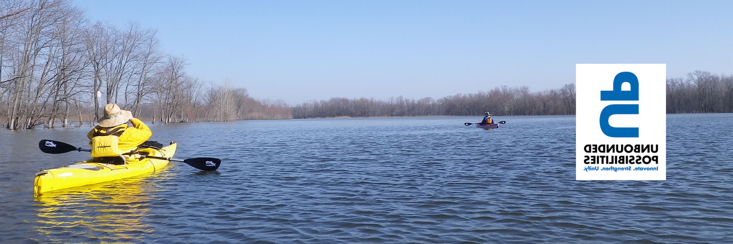 An image of two people in a kayak in the Wabashikii with a logo for unbounded possibilities on teh left side of the image